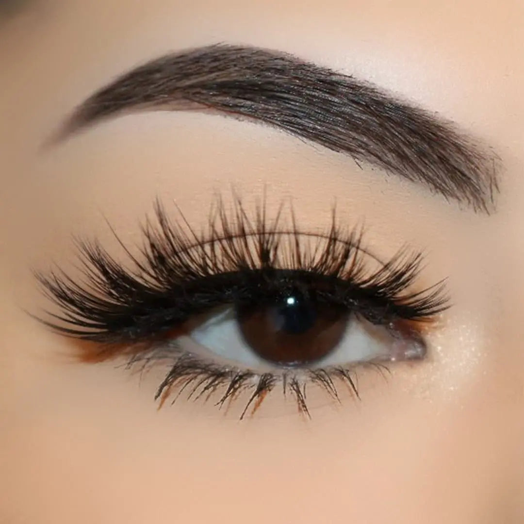 Close-up of an eye wearing Sinful wispy strip lashes
