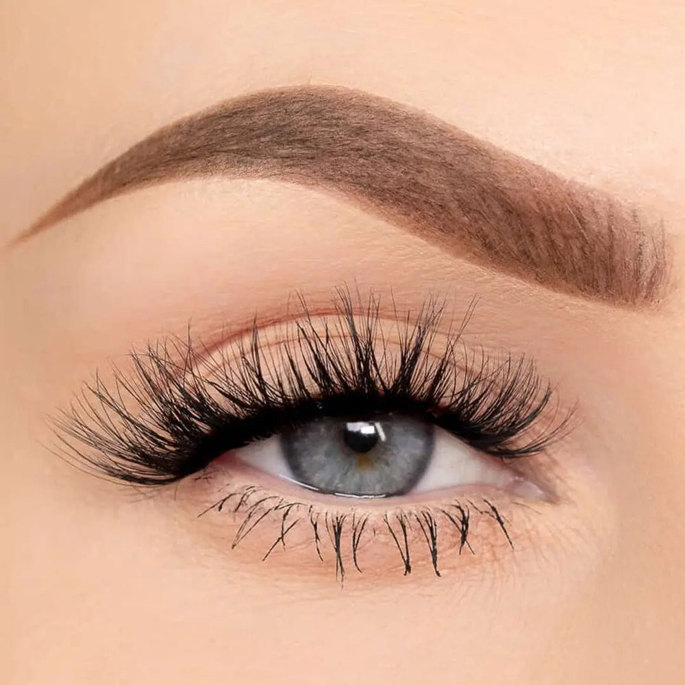 Close-up of an eye wearing After Hours cat eye self-adhesive lash clusters by Wyld Chics