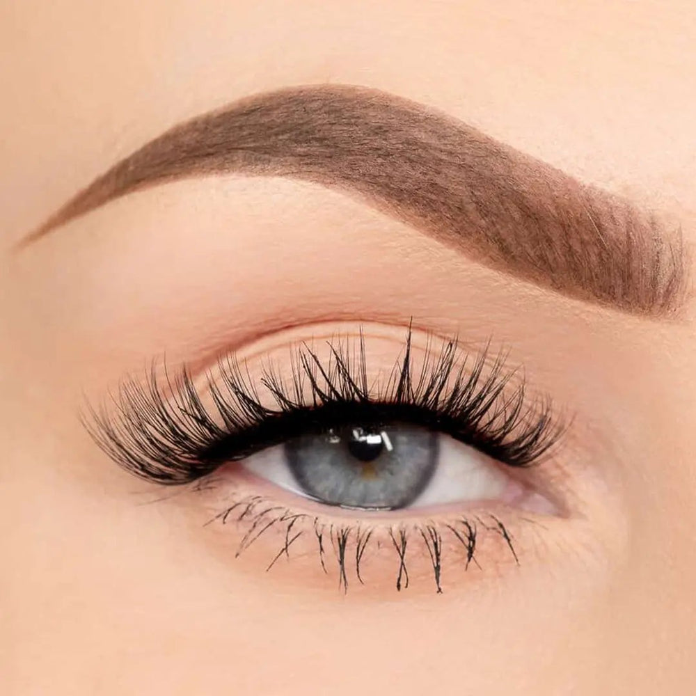 Close-up of an eye wearing Dainty natural self-adhesive lash clusters by Wyld Chics