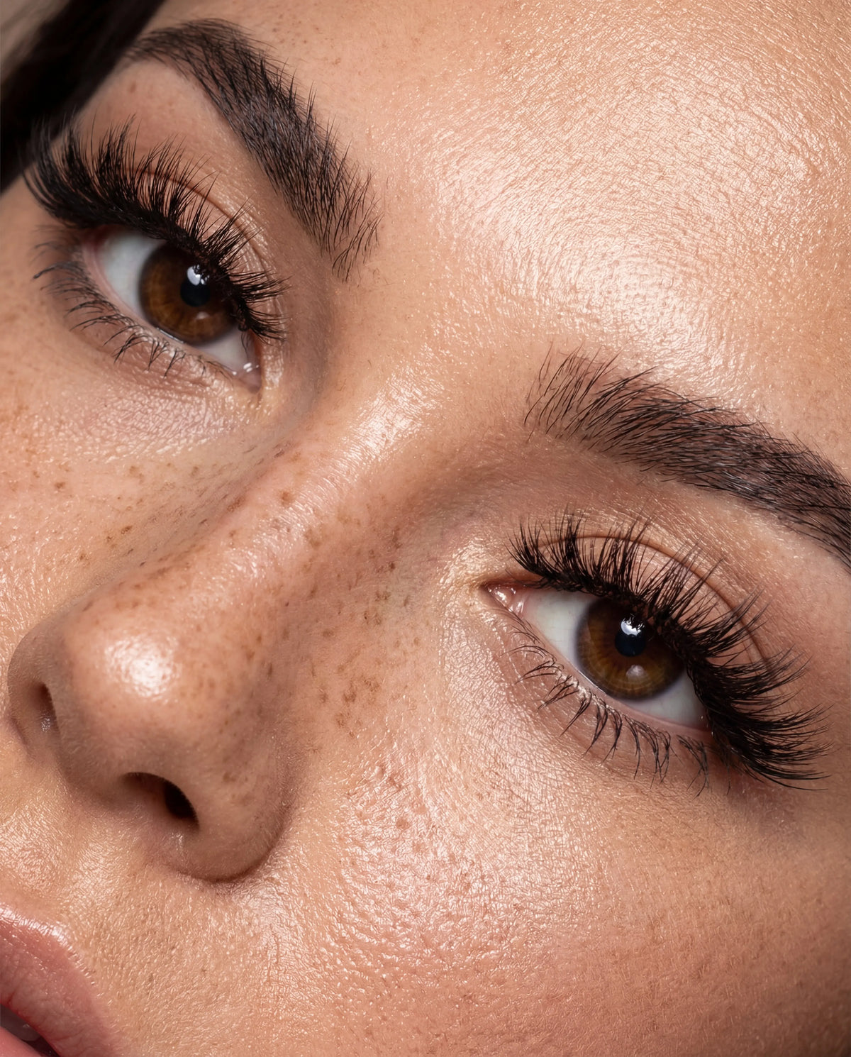 Model with freckles wearing Sinful wispy strip lashes